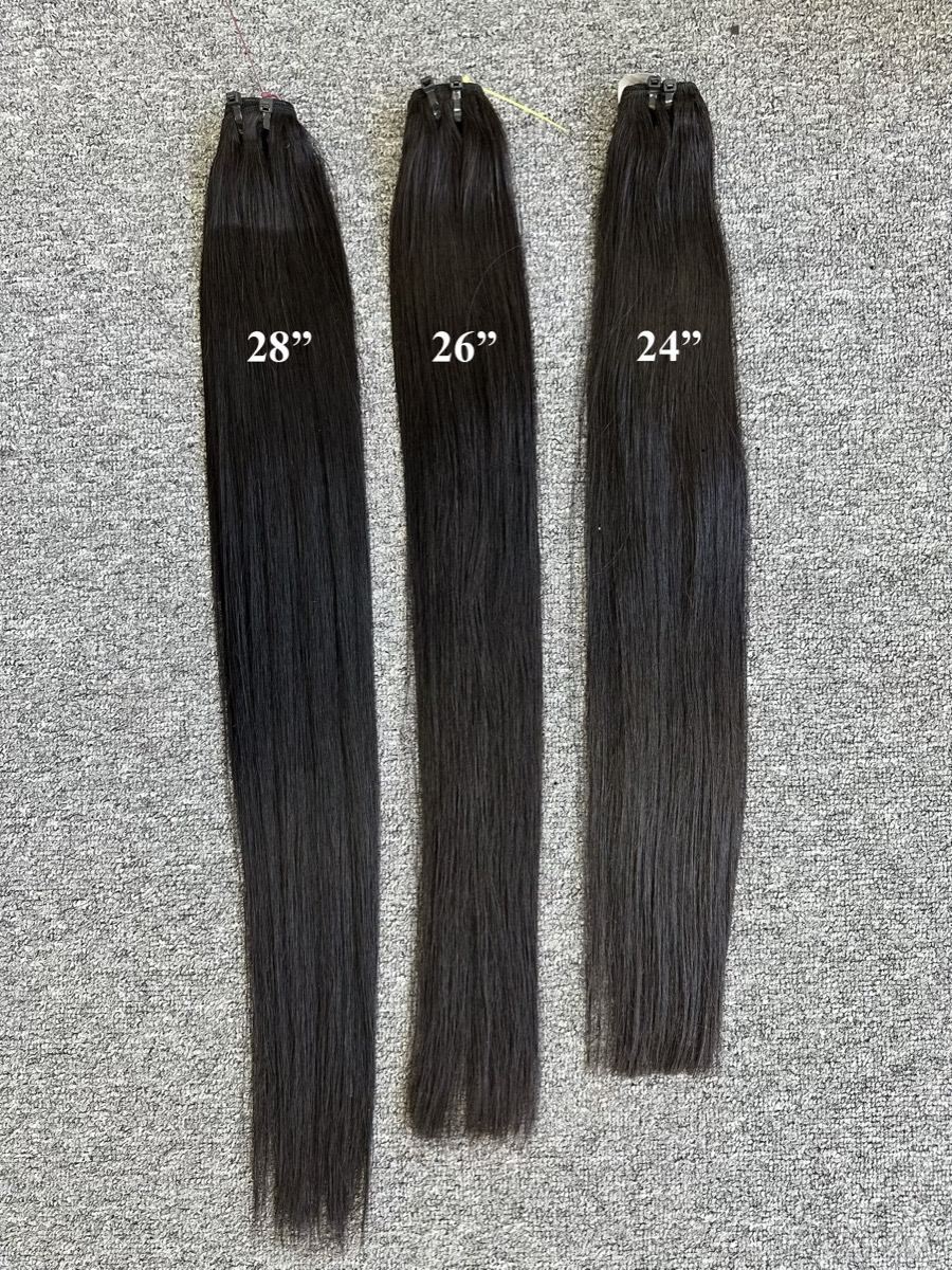 Three straight weft bundles hung side by side, labeled 28, 26 and 24 inches